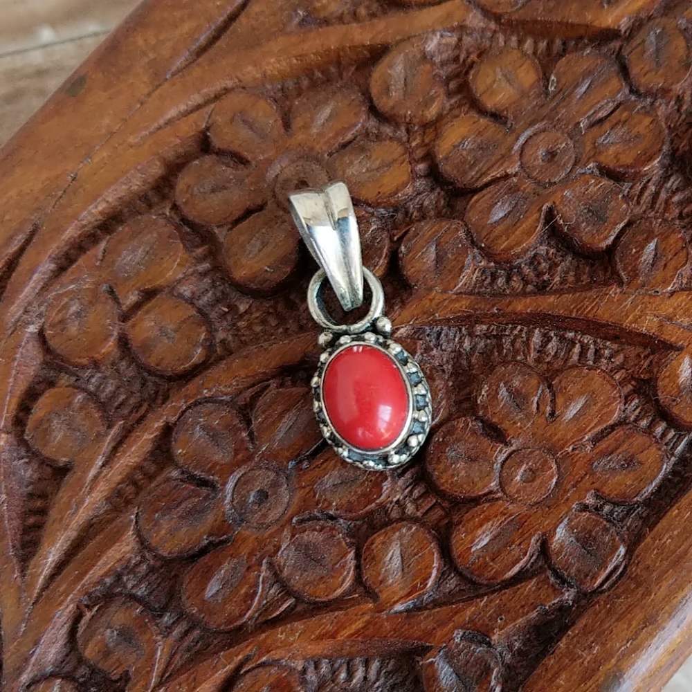 Sterling silver pendant with red stone